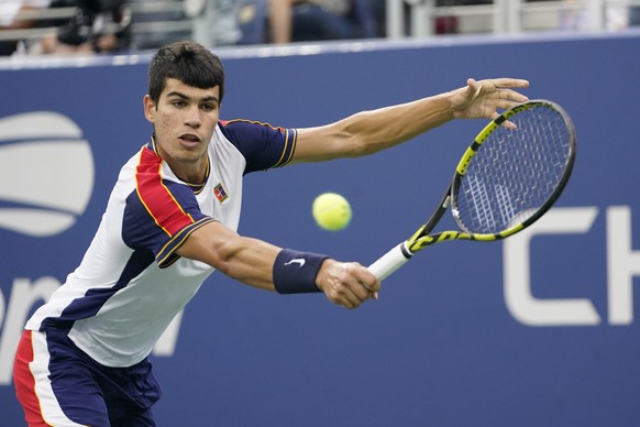 Carlos Alcaraz, of Spain, returns against Peter Gojowczyk, of Germany, during the fourth round of the U.S. Open tennis championships, Sunday, Sept. 5, 2021, in New York. (AP Photo/Frank Franklin II)
C ...