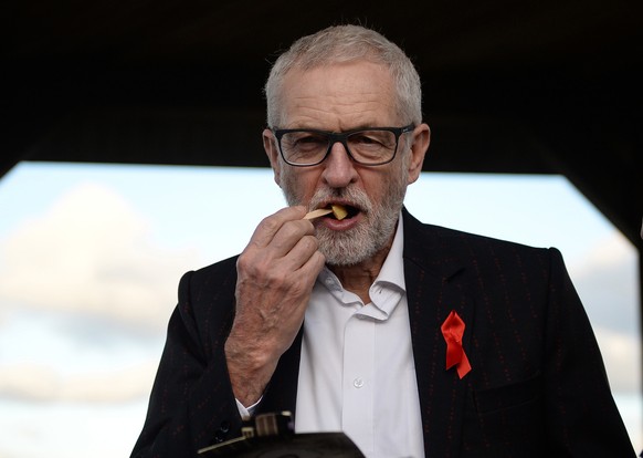 epa08037461 Britain&#039;s opposition Labour Party leader Jeremy Corbyn eats chips during a general election campaign event in Whitby, Britain, 01 December 2019. Britons go to the polls on 12 December ...