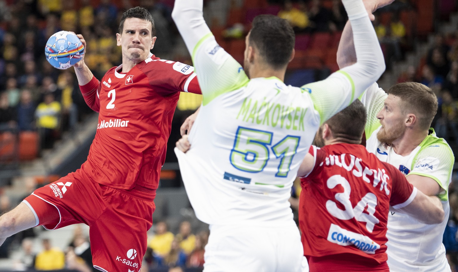 Switzerland&#039;s Andy Schmid, left, in action against Slovenia&#039;s Borut Mackovsek, right, during the menÕs EHF EURO 2020 final tournament Group F match Switzerland against Slovenia in Gothenburg ...