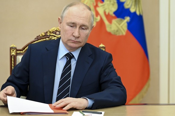 Russian President Vladimir Putin chairs a Security Council meeting via videoconference at the Kremlin in Moscow, Russia, Friday, July 14, 2023. (Aleksey Babushkin, Sputnik, Kremlin Pool Photo via AP)