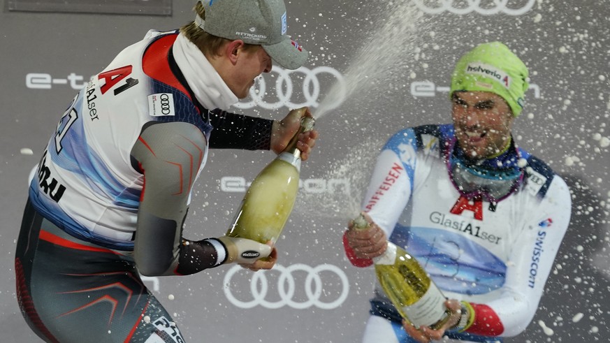 From left, the winner Norway&#039;s Atle Lie McGrath and third placed Switzerland&#039;s Daniel Yule celebrate after completing an alpine ski, men&#039;s World Cup slalom race, in Flachau, Austria, We ...