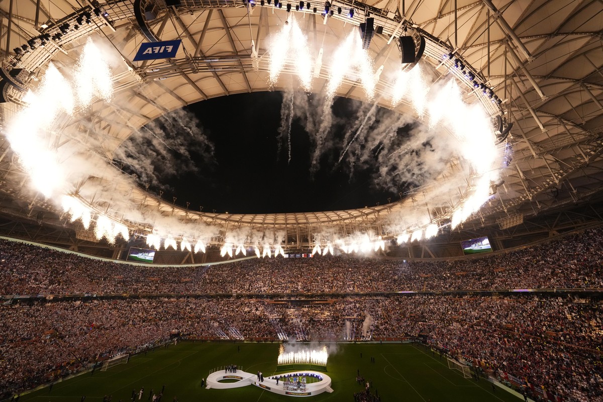 FILE - Fireworks explode as Argentina's team receives the trophy at the end of the World Cup final soccer match between Argentina and France at the Lusail Stadium in Lusail, Qatar, on Dec. 18, 20 ...