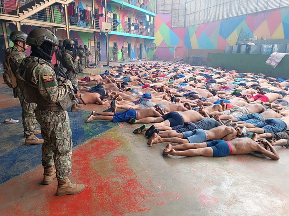 epa11067598 A handout photo made available by the Armed Forces of Ecuador shows the intervention in the Litoral Regional prison, in Guayaquil, Ecuador, 08 January 2024 (issued 10 January 2024). The pr ...