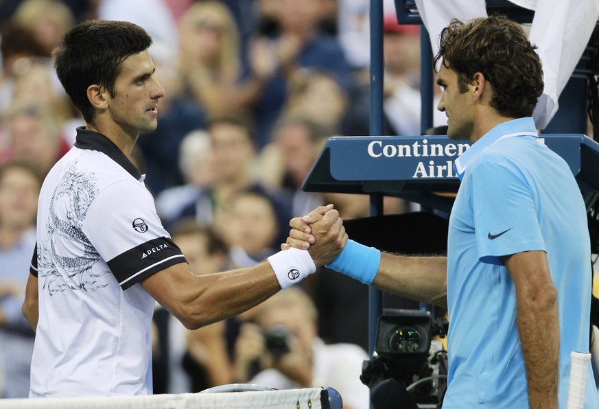 Novak Djokovic, left, of Serbia, is congratulated by Roger Federer, of Switzerland, following a men&#039;s semifinal match at the U.S. Open tennis tournament in New York, Saturday, Sept. 11, 2010. Djo ...