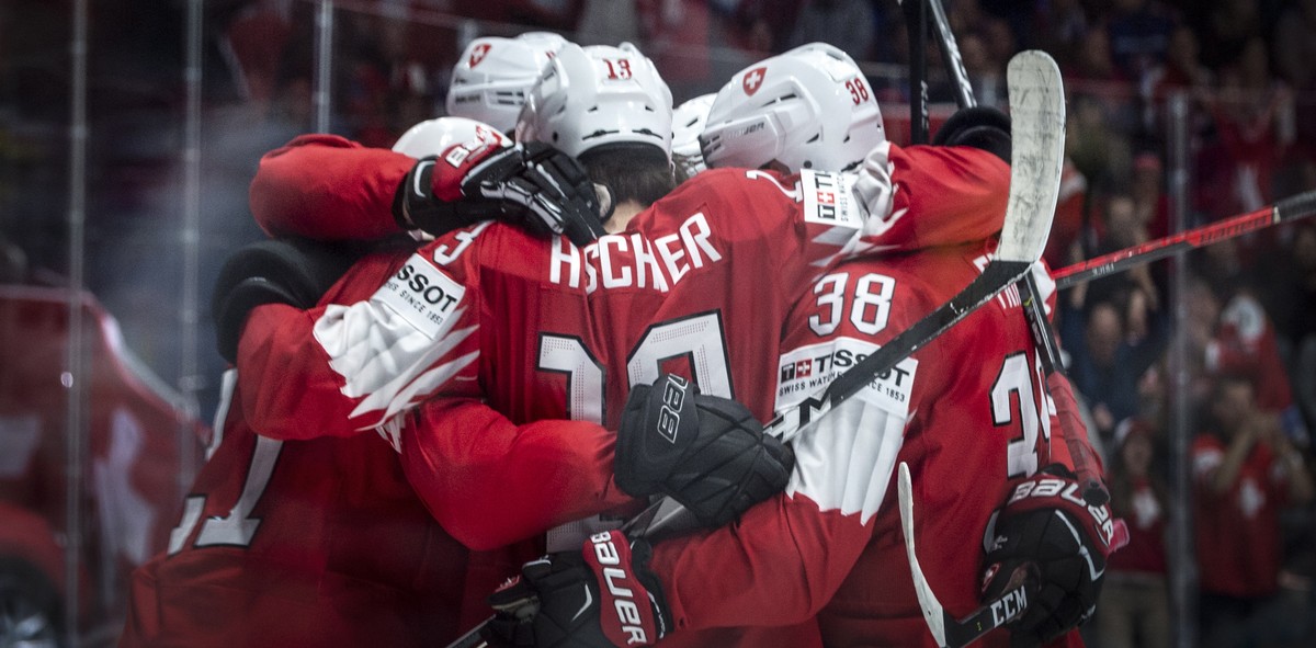 epa07570729 Switzerland's players celebrate during the IIHF World Championship group B ice hockey match between Switzerland and Austria at the Ondrej Nepela Arena in Bratislava, Slovakia, 14 May  ...
