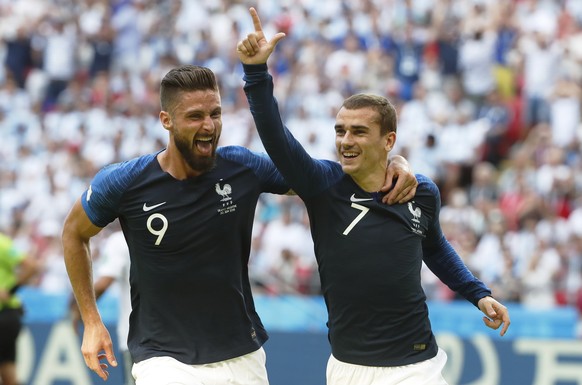 epa06851838 Antoine Griezmann of France celebrates with team mate Olivier Giroud (L) after scoring the 1-0 lead from the penalty spot during the FIFA World Cup 2018 round of 16 soccer match between Fr ...