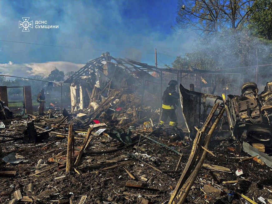 In this photo provided by the Ukrainian Emergency Service, firefighters extinguish a fire following Russia&#039;s air raid in the village of Bilopillya in the Sumy region, Ukraine, Wednesday, May 14,  ...