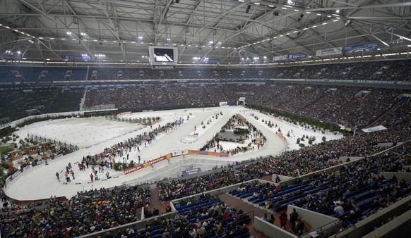 About 50,000 spectators watch the biathlon teams compete on artificial snow during the Biathlon World Team Challenge at the Veltins-Arena in Gelsenkirchen, Germany, Monday, Dec. 29, 2012. (AP Photo/Ma ...