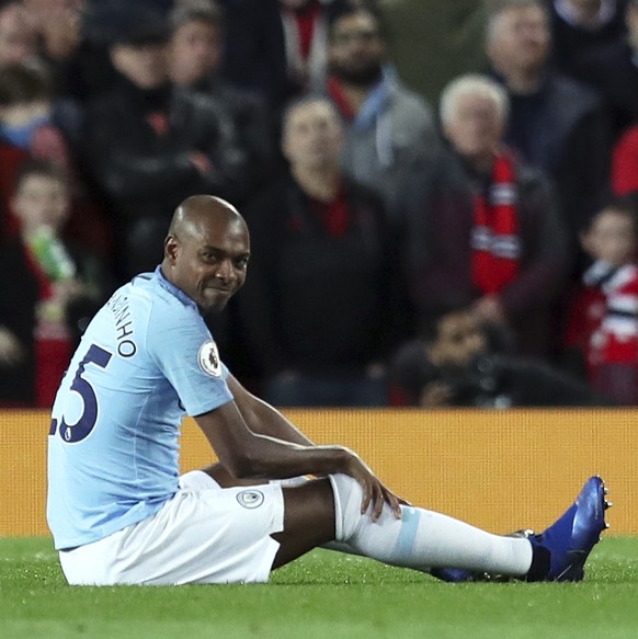 Manchester City's Fernandinho sits on the pitch during the English Premier League soccer match between Manchester United and Manchester City at Old Trafford Stadium in Manchester, England, Wednes ...
