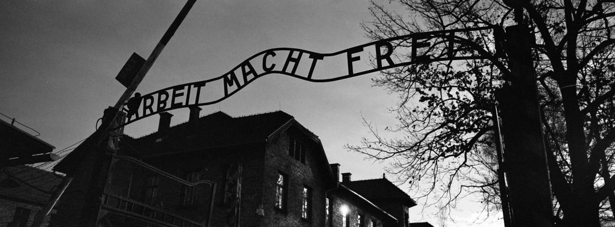 The main entrance at the former Nazi death camp of Auschwitz in Oswiecim, Poland, with the inscription, 'Arbeit Macht Frei', which translates into English as '"Work will set you Fr ...