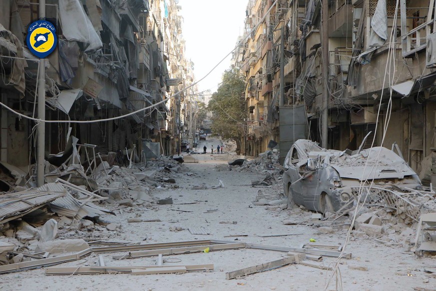 In this photo provided by the Syrian Civil Defense group known as the White Helmets, shows heavily damaged buildings after airstrikes hit in Aleppo, Syria, Saturday, Sept. 24, 2016. Syrian government  ...