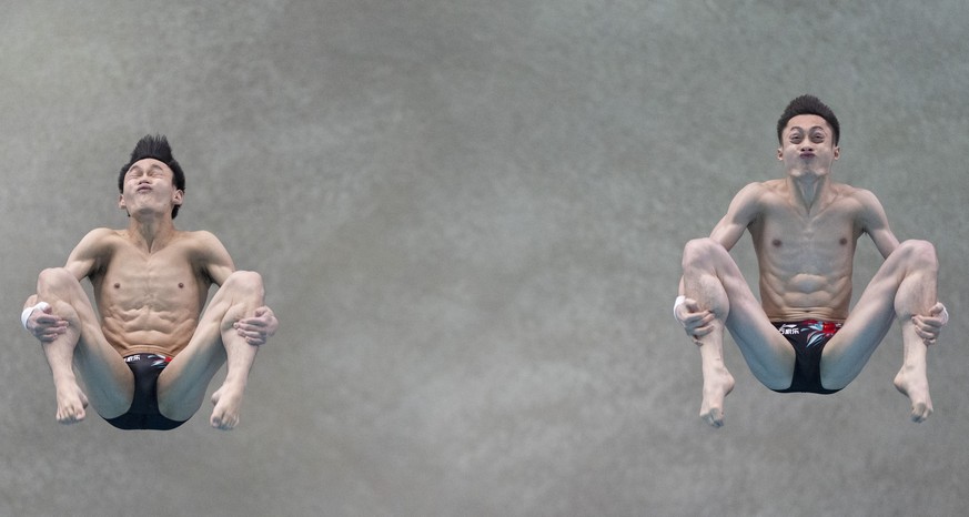 Lian Junjie and Yang Hao, of China, compete during the men&#039;s 10m synchronized platform final at the diving World Cup in Montreal, Sunday, March 3, 2024. (Christinne Muschi/The Canadian Press via  ...