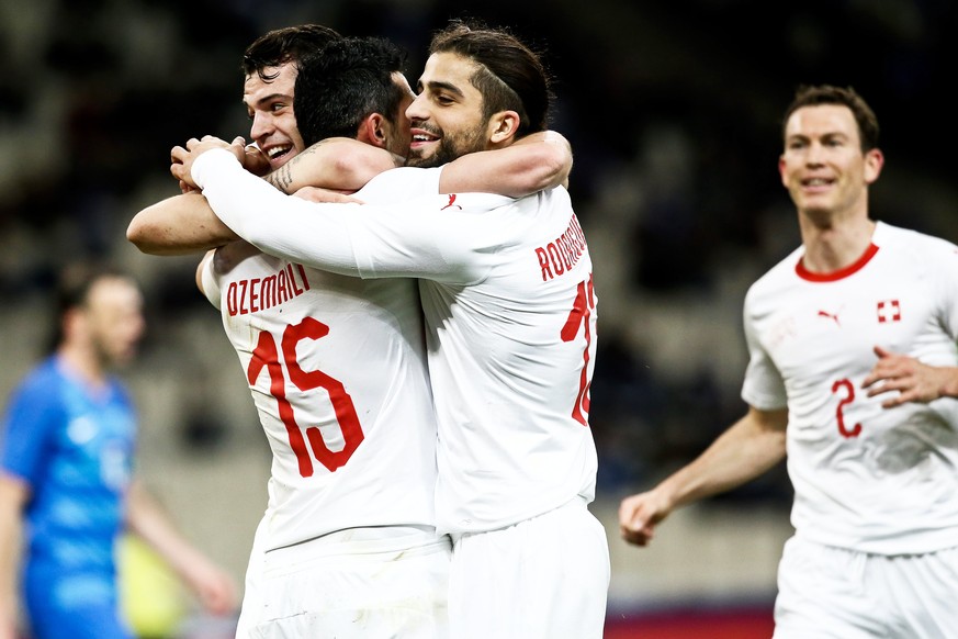 epa06624711 Switzerland&#039;s midfielder Blerim Dzemaili (2-L) celebrates with his teammates Granit Xhaka (L) and Ricardo Rodriguez (C) after scoring the 1-0 lead during the International Friendly so ...