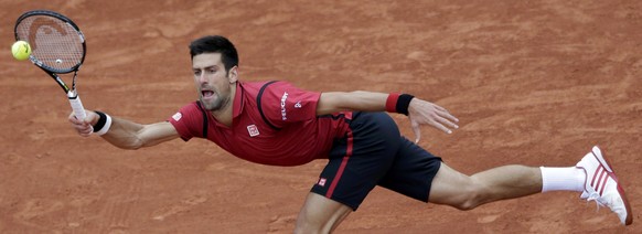 Tennis - French Open Mens Singles Semifinal match - Roland Garros - Novak Djokovic of Serbia v Dominic Thiem of Austria - Paris, France - 03/06/16. Novak Djokovic returns a shot. REUTERS/Jacky Naegele ...