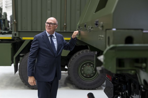 Federal Councilor Martin Pfister knocks on a side panel of a Skyranger air defence system during an official visit on Monday, July 6, 2026, in the Competence- and Manufacturing Center of the Rheinmeta ...