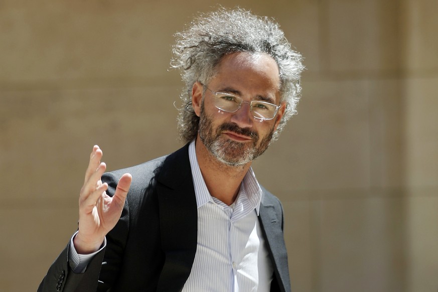 FILE - In this Wednesday, May 15, 2019, file photo, Palantir CEO Alex Karp arrives for the Tech for Good summit in Paris. Seventeen years after it was born with the help of CIA seed money, Palantir Te ...