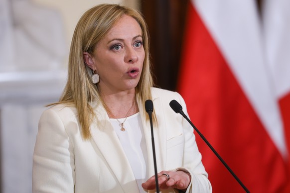 epa10480420 Italian Prime Minister Giorgia Meloni addresses a joint press conference with her Polish counterpart Morawiecki after their meeting in Warsaw, Poland, 20 February 2023. EPA/Rafal Guz POLAN ...