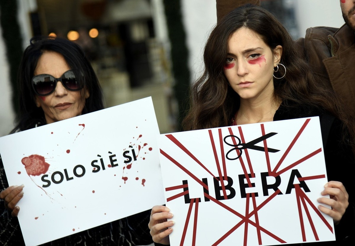 epa10994155 Activists hold placards during a protest called by the Azione party on the occasion of the International Day for the Elimination of Violence Against Women, in Rome, Italy, 25 November 2023 ...