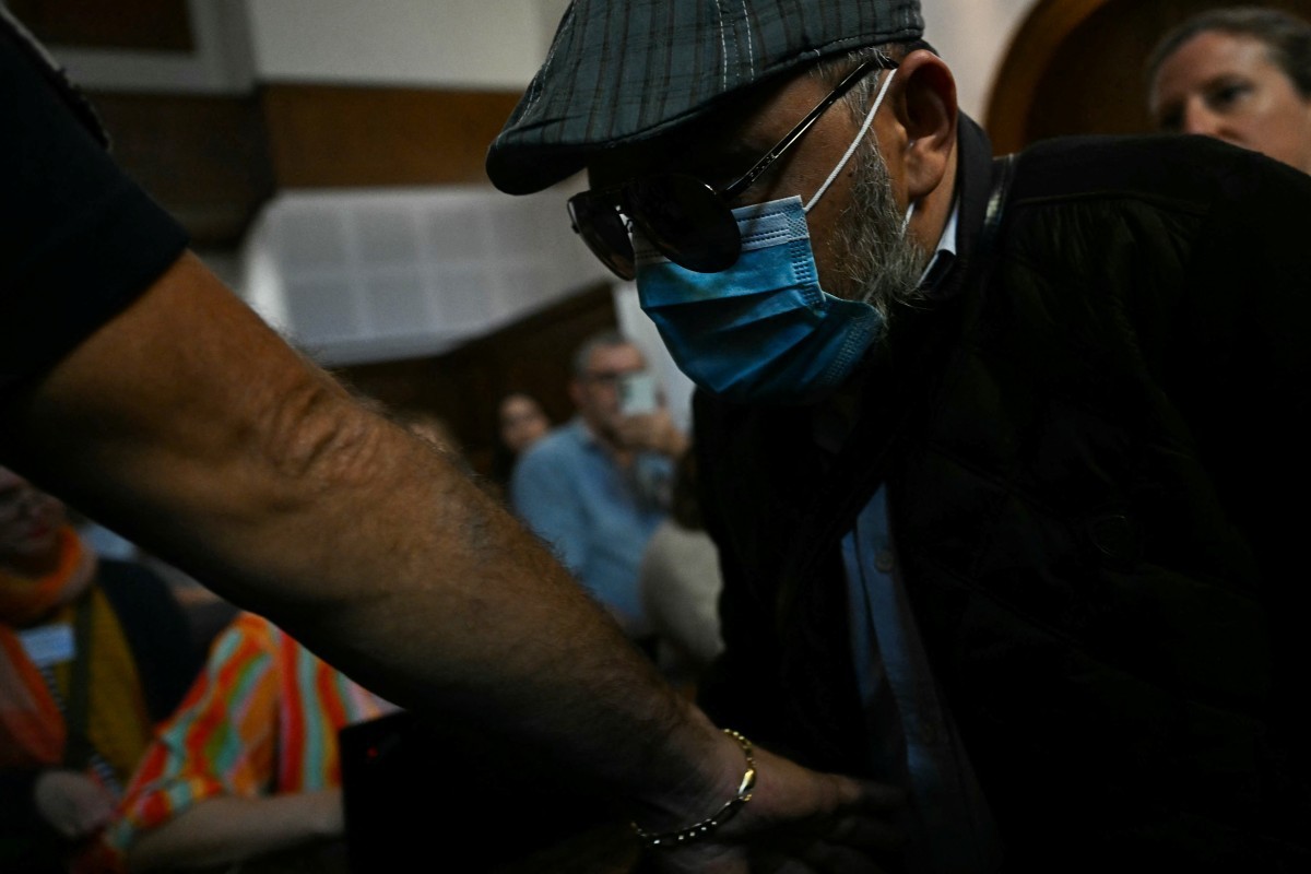 Defendant Husamettin Dogan arrives in the courtroom to attend the appeal trial in the Mazan rape case at the Nimes courthouse in Nimes, southern France, on October 9, 2025. The trial will take place a ...