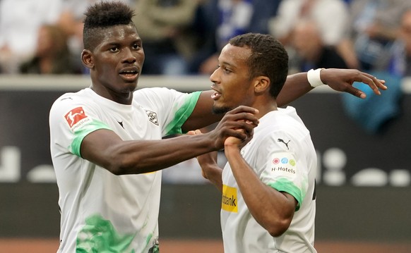 epa07876706 Moenchengladbach's Alassane Plea (R) celebrates with Breel Embolo after scoring the opening goal during the German Bundesliga soccer match between TSG 1899 Hoffenheim and Borussia Moe ...