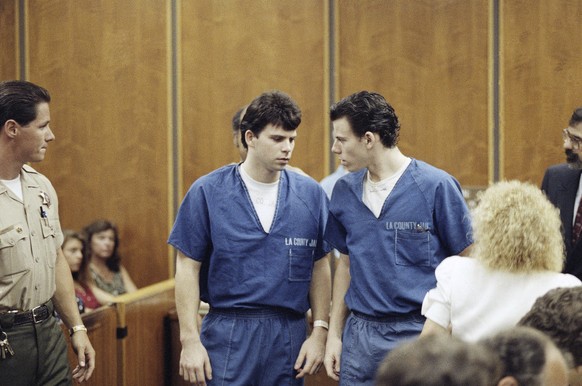 FILE - Lyle, left, and Erik Menendez leave a courtroom in Santa Monica, Calif., Aug. 6, 1990, after a judge ruled that conversations between the brothers and their psychologist after their parents wer ...