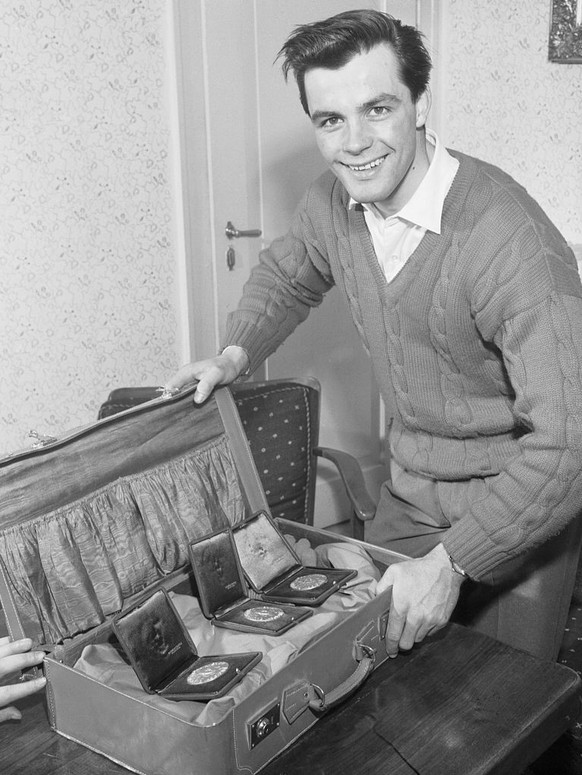 (Original Caption) Austrian ski prodigy Anton Sailer, who made a clean sweep of the men's slalom, special slalom ant the downhill, at the Seventh Winter Olympics at Cortina, packs up his gold med ...