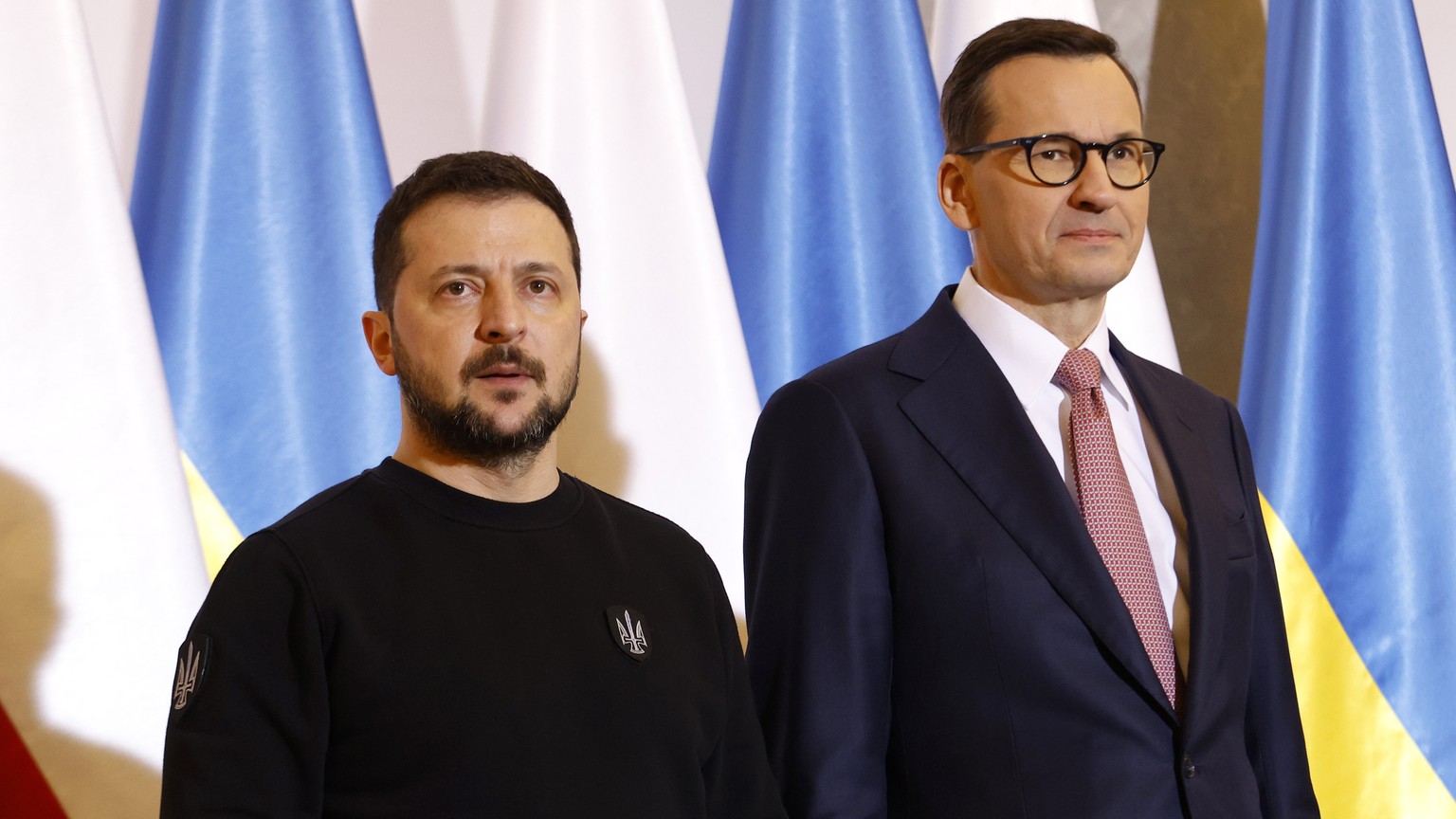 FILE -Poland&#039;s Prime Minister Mateusz Morawiecki, right, welcomes Ukrainian President Volodymyr Zelenskyy as they meet in Warsaw, Poland, Wednesday, April 5, 2023. Poland&#039;s prime minister sa ...