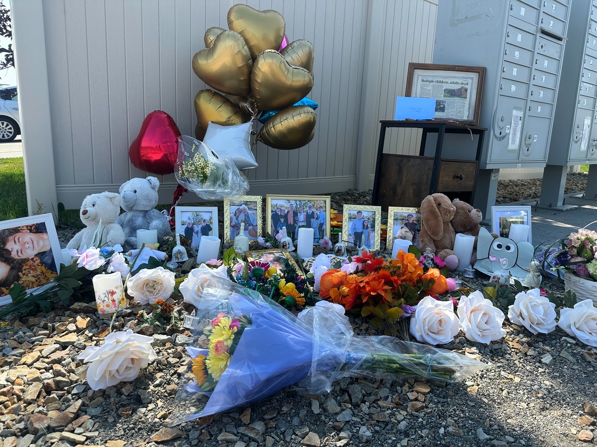 Flowers sit at a memorial honoring eight family members who were killed while gathering for dinner near the family home outside Billings, Mont., Wednesday, Aug. 26, 2026. (AP Photo/Matthew Brown)
Mont ...