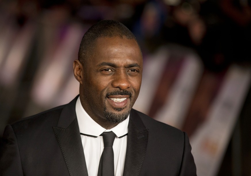 FILE- In this file photo photo dated Thursday, Dec. 5, 2013, British actor Idris Elba who plays Nelson Mandela in the movie &quot;Mandela: Long Walk to Freedom&quot;, poses for photographers in London ...