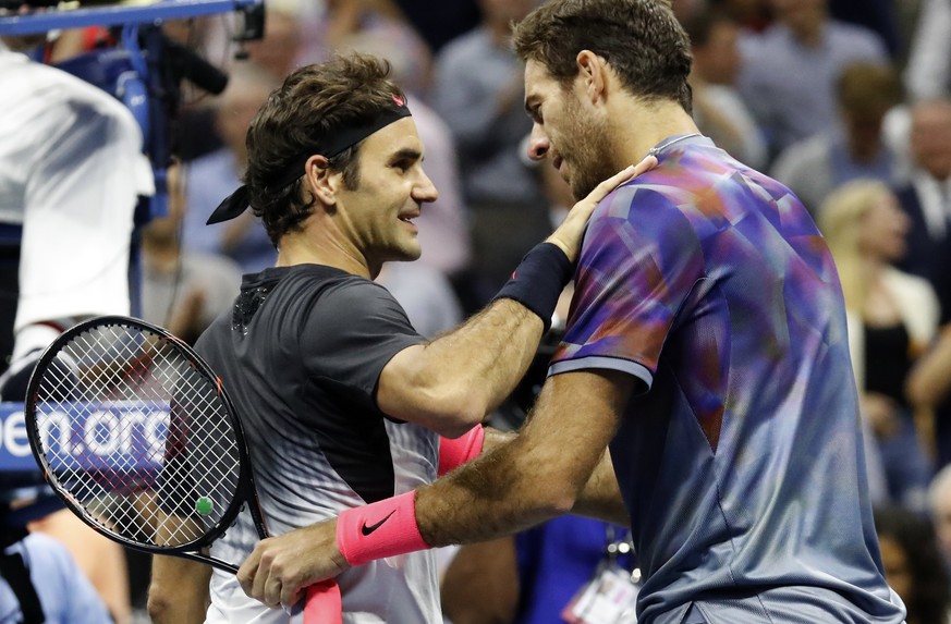 epa06189007 Juan Martin del Potro of Argentina (R) greets Roger Federer of Switzerland (L) at the net after defeating him in four sets during their US Open Tennis Championships quarterfinals round mat ...