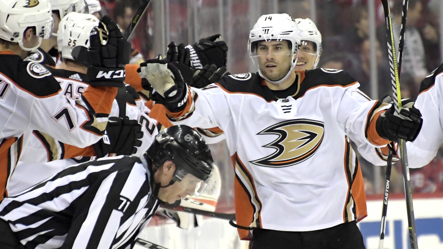 Anaheim Ducks center Adam Henrique (14) celebrates his goal during the second period of an NHL hockey game against the New Jersey Devils, Monday, Dec.18, 2017, in Newark, N.J. (AP Photo/Bill Kostroun)