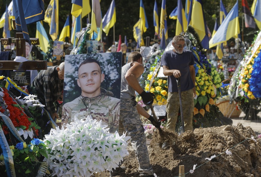 epa10848429 Relatives, friends and comrades of late Ukrainian rescue unit member Ruslan Koshovyi attend his funeral in Kyiv, Ukraine, 08 September 2023. Koshovyi died on 24 February 2022, the first da ...