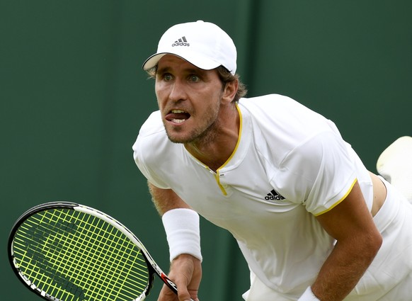 epa06065011 Mischa Zverev of Germany in action against Bernard Tomic of Australia during their first round match for the Wimbledon Championships at the All England Lawn Tennis Club, in London, Britain ...