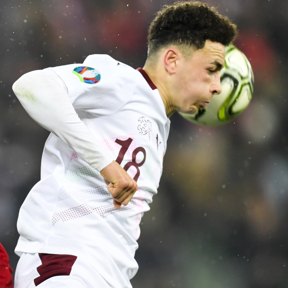 Georgia's Giorgi Kvilitaia, left, versus Switzerland's forward Ruben Vargas, during the UEFA Euro 2020 qualifying Group D soccer match between Switzerland and Georgia at the Kybunpark stadiu ...