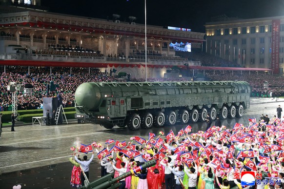 This photo provided by North Korean government shows what it says a new intercontinental ballistic missile called the Hwasong-20, during a military parade marking the 80th anniversary of the founding  ...