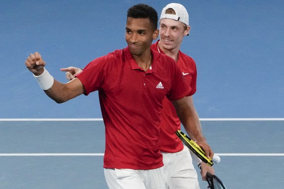 Canada&#039;s Denis Shapovalov and teammate Felix Auger-Aliassime, left, celebrate after defeating Britain&#039;s Jamie Murray and Joe Salisbury in their match at the ATP Cup tennis tournament in Sydn ...