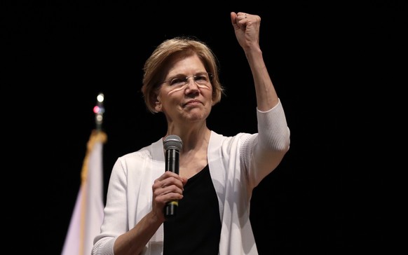 FILE - In this Aug. 8, 2018 file photo, U.S. Sen. Elizabeth Warren, D-Mass., gestures during a town hall style gathering in Woburn, Mass. She took the DNA test President Donald Trump urged. She’s hitt ...