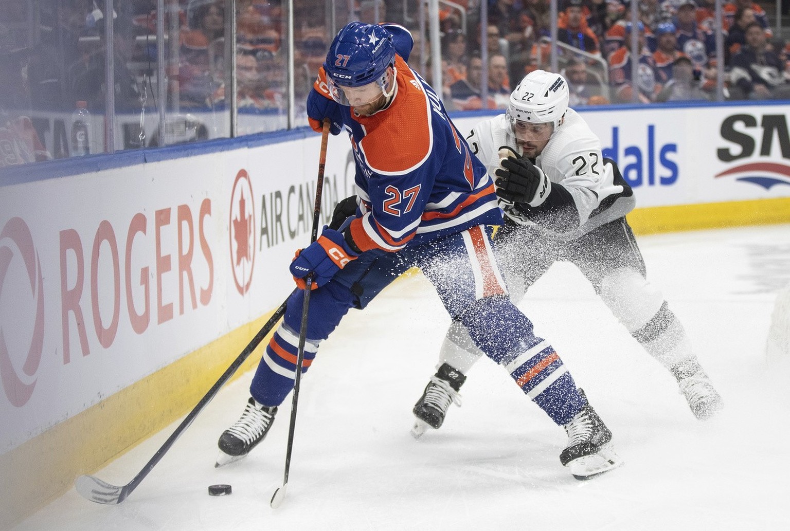 Los Angeles Kings&#039; Kevin Fiala (22) and Edmonton Oilers&#039; Brett Kulak (27) battle for the puck during the first period in Game 5 of an NHL hockey Stanley Cup first-round playoff series, on We ...