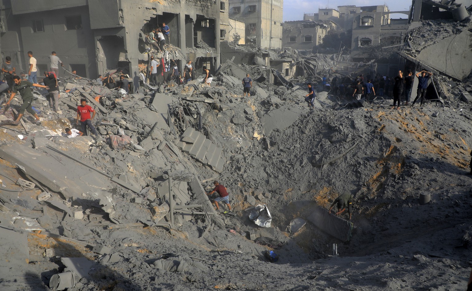 Palestinians look for survivors among the rubble of destroyed buildings following Israeli airstrikes on Jabaliya refugee camp on the outskirts of Gaza City, Tuesday, Oct. 31, 2023. (AP Photo/Abdul Qad ...