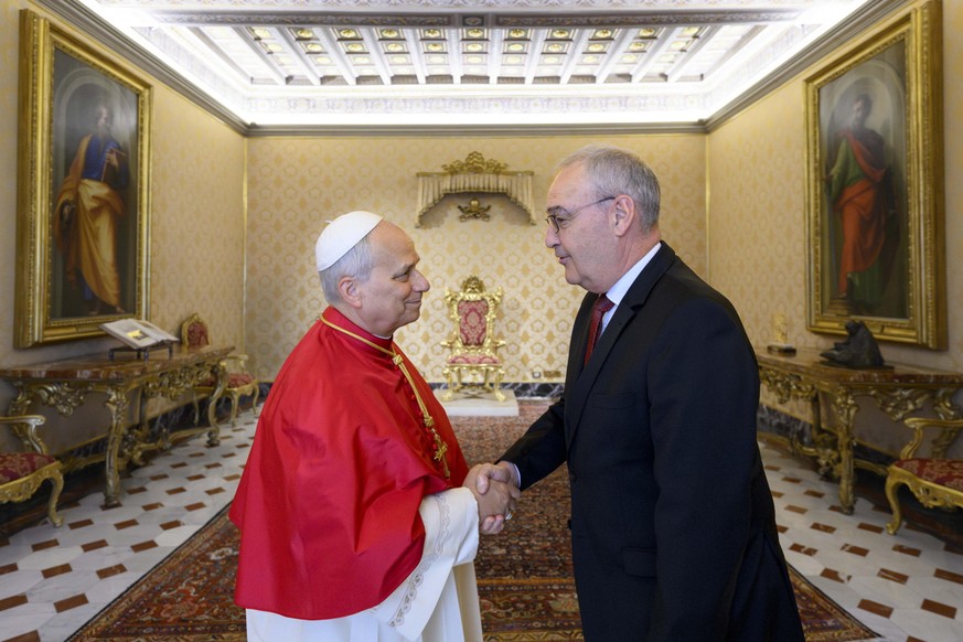 KEYPIX - epa12935861 A handout picture provided by Vatican Media shows Pope Leo XIV (L) meeting Guy Parmelin, President of the Swiss Confederation, during an audience in Vatican City, 06 May 2026. EPA ...