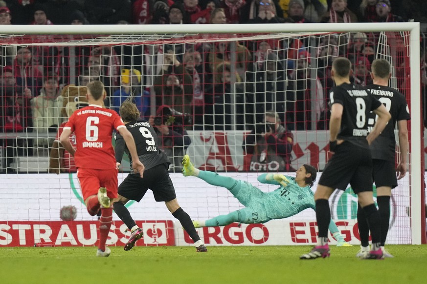 Freiburg&#039;s Lucas Hoeler, second right, shoots a penalty kick to score his side&#039;s second goal during Germany Cup quarter final match between Bayern Munich and SC Freiburg at the Allianz Arena ...