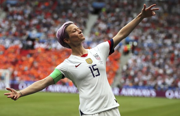 FILE - In this Sunday July 7, 2019 file photo, United States' Megan Rapinoe celebrates after scoring the opening goal from the penalty spot during the Women's World Cup final soccer match be ...