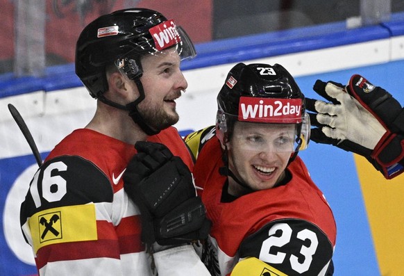 L-R Dominic Zwerger, Marco Rossi and Peter Schneider all AUT celebrate a goal during the 2024 IIHF World Championship, WM, Weltmeisterschaft group A, match Canada vs Austria, in Prague, Czech Republic ...
