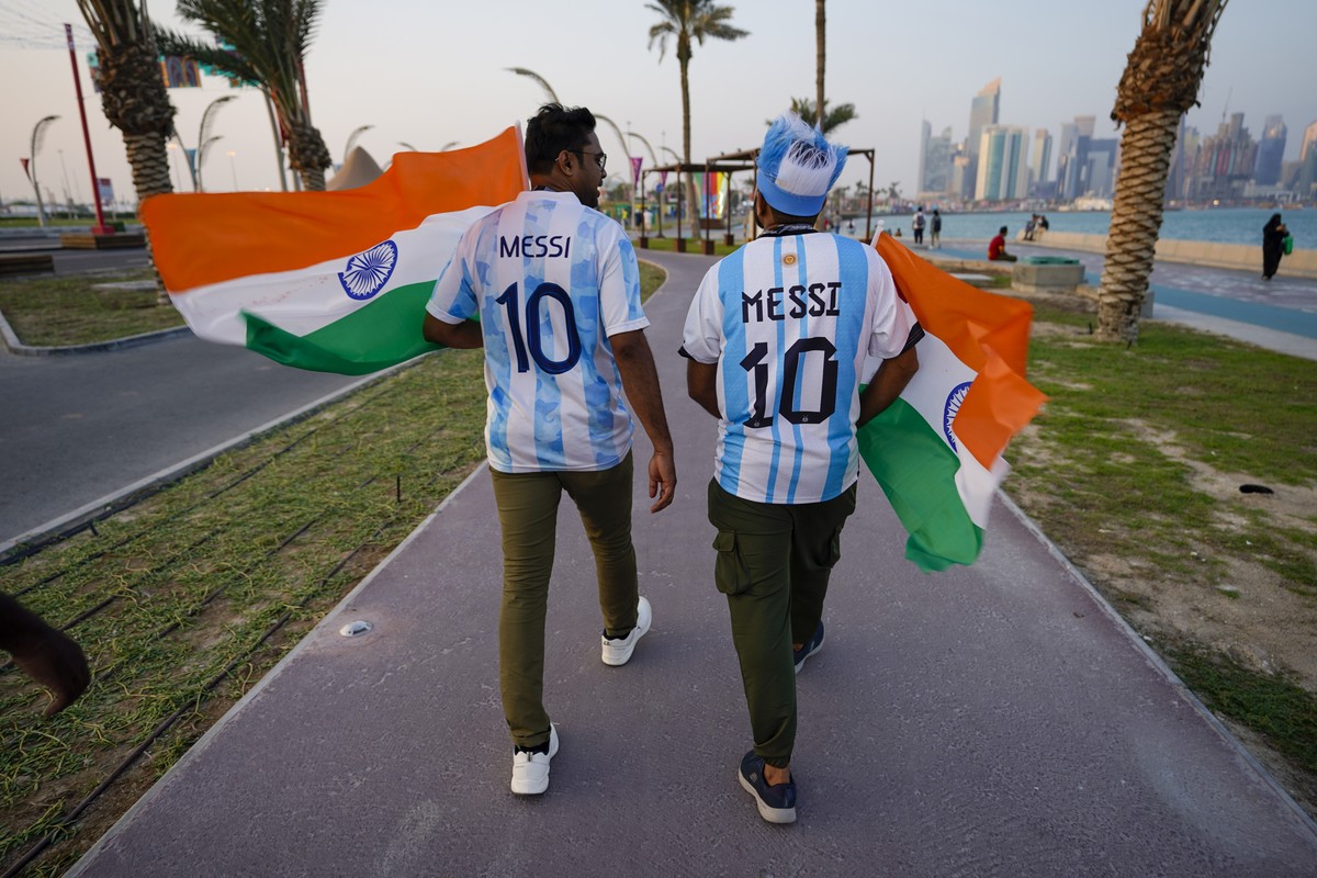 Fans wearing jerseys of Argentina arrive to a fan zone prior to the World Cup group A soccer match between Qatar and Ecuador in Doha, Qatar, Sunday, Nov. 20, 2022. (AP Photo/Moises Castillo)