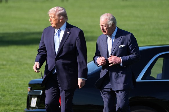 KEYPIX - President Donald Trump and Britain's King Charles III arrive to look at the White House garden and bee hive on the South Lawn of the White House, Monday, April 27, 2026, in Washington. ( ...