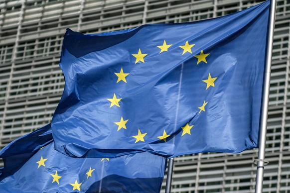 epa08665769 European union flags wave in front of the Berlaymont building headquarters in Brussels, Belgium, 13 September 2020. Media reports the European Union is prepared in the event of an unfavora ...