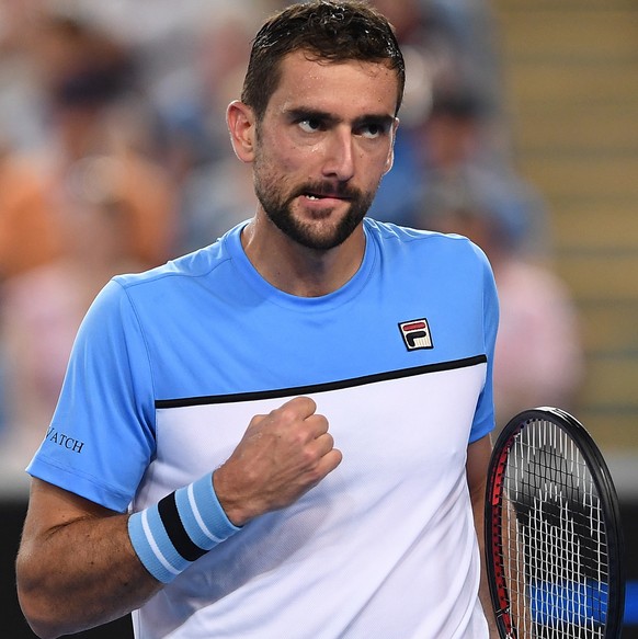 epa07282438 Marin Cilic of Croatia reacts during his men&#039;s singles first round against Bernard Tomic of Australia at the Australian Open tennis tournament in Melbourne, Australia, 14 January 2019 ...