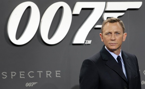 FILE - This is a Wednesday, Oct. 28, 2015 file photo of actor Daniel Craig poses for the media as he arrives for the German premiere of the James Bond movie &#039;Spectre&#039; in Berlin, Germany. The ...