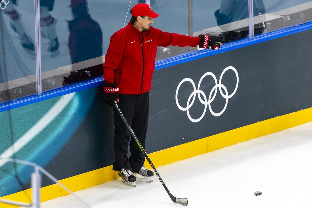 Patrick Fischer, head coach of Switzerland national ice hockey team, instructs his players during a training session of team Switzerland at the 2026 Olympic Winter Games in Milan Santa Giulia Ice Hock ...