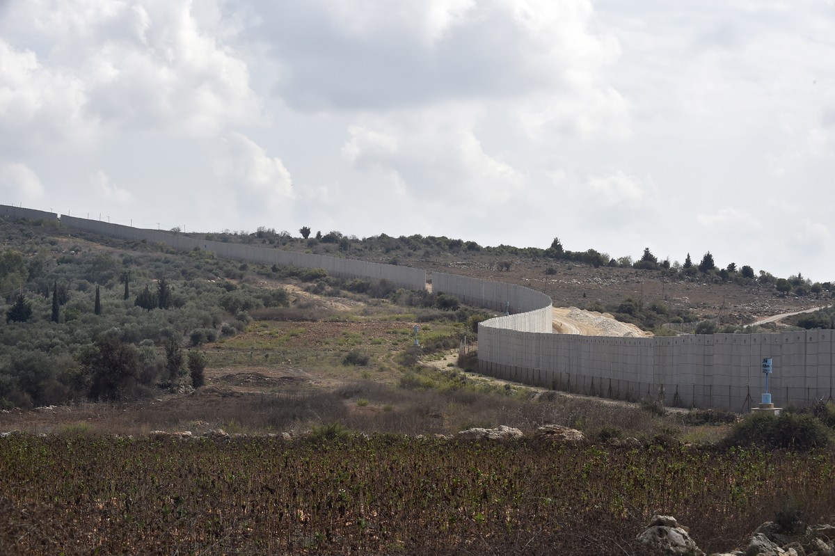 epa10911864 A general view of the wall at the Israeli-Lebanon border, seen from the Dhayra village, southern Lebanon, 10 October 2023. According to Hezbollah, three fighters of the group were killed d ...